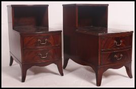 A pair of Georgian campaign style mahogany and leather topped stepped bedside cabinets with two
