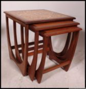 A set of three graduating teak tiled topped G Plan 1970's teak occasional / nest of  tables,