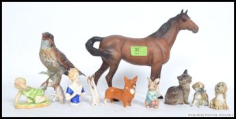 A collection of ceramic figurines to include a Royal Worcester  ' Michael ' by FG Doughty,