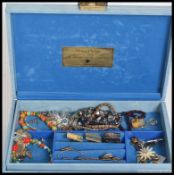 A collection of costume jewellery to include brooches, necklaces etc.