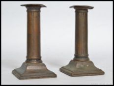 2 Georgian 19th century silver plated copper candlesticks.