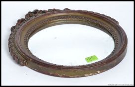 A mid century Regency style gilt finished convex - fish eye wall mirror.