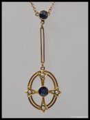 An Art Nouveau 9ct gold Sapphire and seed pearl pendant and necklace chain.