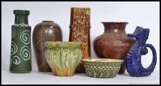 A collection of vases to include West German, Denby,