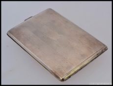 A silver 925 engine turned cigarette case with reeded design. Stamped KV 925. Total weight 144.7g.