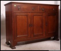 A Victorian Arts & Crafts oak sideboard dresser.