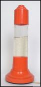 A vintage retro 20th century Orange coloured plastic Lava lamp of rocket shaped form .