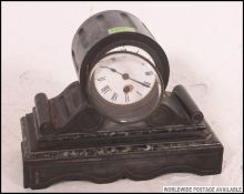 A Victorian slate and veined marble cylinder drum head clock with enamel face and brass inset