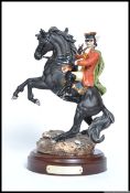 A Royal Doulton limited edition 935 /5000 ceramic figure of Dick Turpin HN 3272 on turned wooden