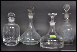 4 glass decanters, circa 20th century to include 2 ships decanters, all with stoppers.