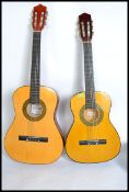 A six string acoustic Spanish style guitar by Herald along with a similar 3/4 six string