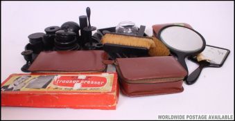 A collection of 3 vintage gentlemans leather vanity cases with contents along with ebonised wooden
