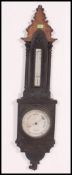 A Victorian Irish large oak aneroid wall barometer.