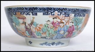 A 19th century Chinese bowl, having hand painted court scene panels,