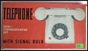 A retro boxed childrens Telephone inter communication set with signal bulb retaining its original