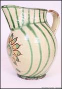 A large Italian majolica cream glazed mid 20th century vase of baluster form being decorated with