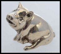 A silver hallmarked  pig figurine ( seated ).