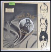 The Jam / Paul Weller - The Jam ' Dig The New Breed ' long play vinyl record being signed by the
