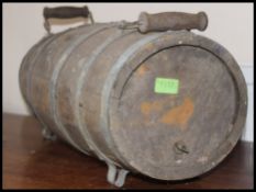 An late 19th early 20th century washing mangle along with a similar aged coopered barrel having a