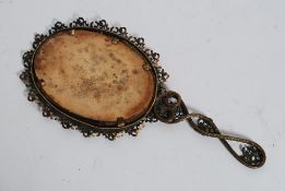 A vintage mid century gilt metal rococo ladies hand mirror.