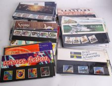 A large collection of unused decimal stamp presentation packs.