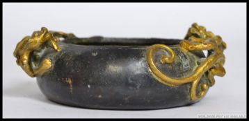 A Chinese brass / bronze  censur dish beautifully embellished with twin dragons to the sides.