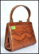 A 20th century snakeskin ladies handbag, with makers label to inside for Rampet.