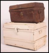 Two vintage mid 20th century tin trunks having clasps and latches to front with hinged lid