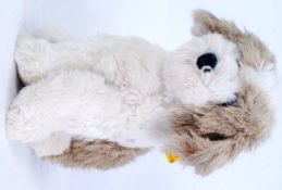 STEIFF: A 20th century Steiff stuffed toy teddy dog - 2883/35. Ear button present.