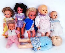 DOLLS: A collection of 6x vintage plastic / vinyl dolls, with clothing. One a Roddy doll.