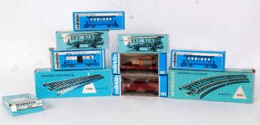 MARKLIN: A collection of 10x Marklin HO/00 Gauge boxed wagons and railway trainset accessories.