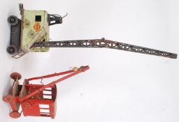 CRANES: Two vintage post war tinplate toy cranes.