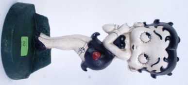 BETTY BOOP: A contemporary cast iron door stop, hand painted, in the form of cartoon Betty Boop.
