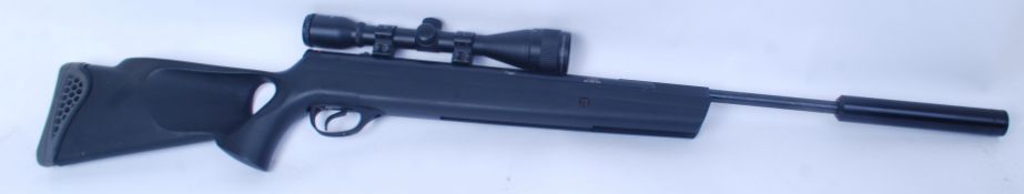 A .22 cal Quattro Trigger air rifle complete with a Nikko Sterling  6 x 40 AO mount master scope.