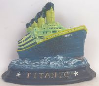 TITANIC: A good heavy cast iron doorstop, in the form of the Titanic, hand painted,
