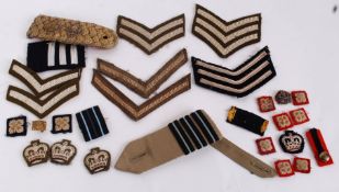 A collection of British military personnel NCO and officer ranking s to include stripes, Pips,