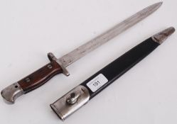 A vintage, believed American made military issue rifle bayonet. Wooden clad handle, no makers marks.