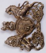 A 20th century uniform helmet plate / badge, in the form of the British coat of arms,