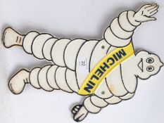 MICHELIN MAN: A vintage style cast iron Michelin Man advertising sign, in the shape of Bibendum,