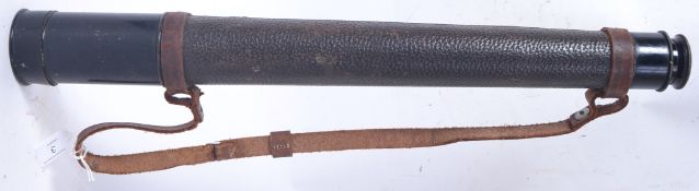 A vintage military style Busch telescope ( 20x magnification) with original leather strap.