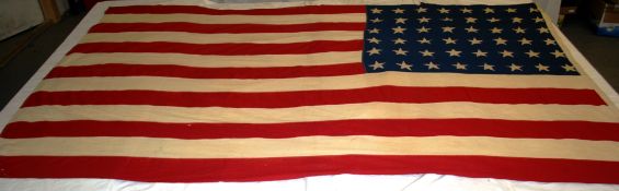 A 20th century  military American flag being machine stitched with dyed panel stars.