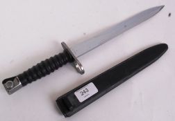 A Swiss military bayonet, 20th century. Marked 54530 to blade. Within the hard plastic sheath case.