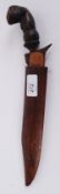 A 19th century Polynesian small Kriss -sword / dagger Within a hardwood scabbard  having a double