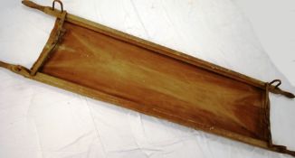 A believed World War One canvas and wooden bound trenches stretcher.