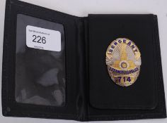 An original Los Angeles Police Dept. officers warrant / uniform badge. Sgt 714.