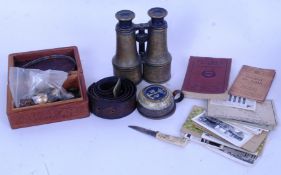 MILITARIA: A collection of assorted militaria / military related items to include brass binoculars,