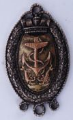A silver hallmarked military naval medal  with anchor and lobster motif.