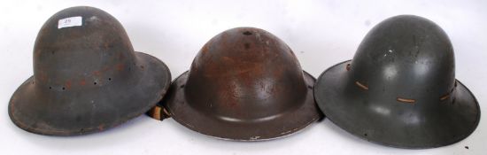 HELMETS: A collection of 3x WWII Second World War tin helmets, British.