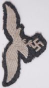 A Third Reich / Nazi second world war WWII era Luftwaffe tunic eagle uniform cloth patch.