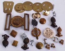 A collection of military WWII and later cap badges and buttons to include Royal Engineers,